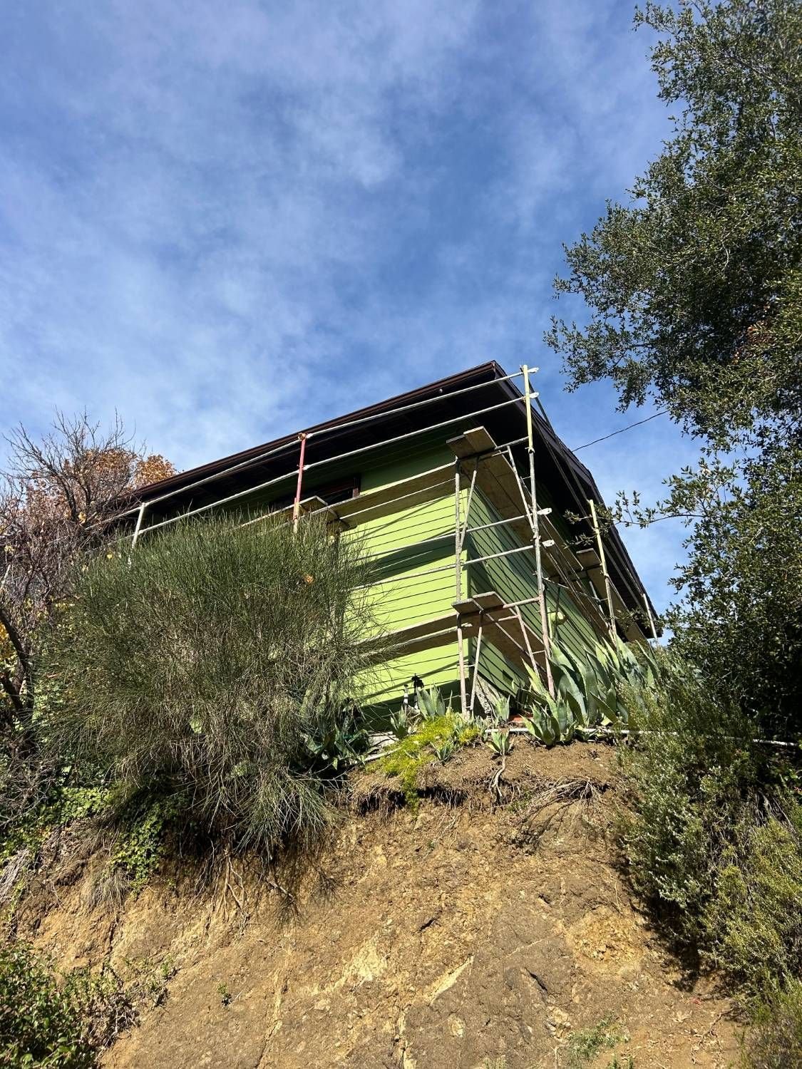 Fiber cement siding by Right Image Builders: finished James Hardie lap siding on a three-level hillside house after a full tear-off