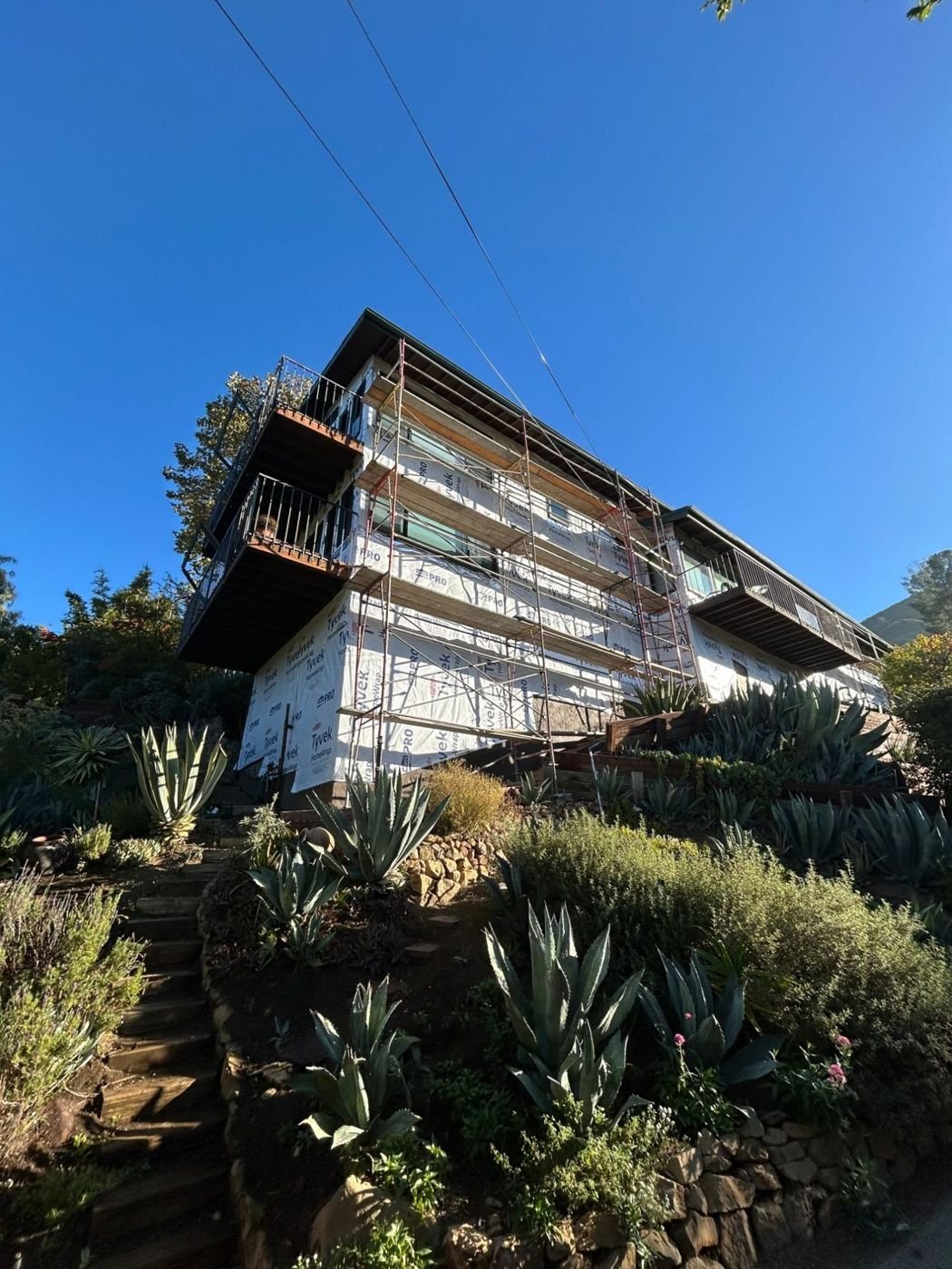 A whole elevation wrapped in weather-resistive barrier, ready for lath or siding