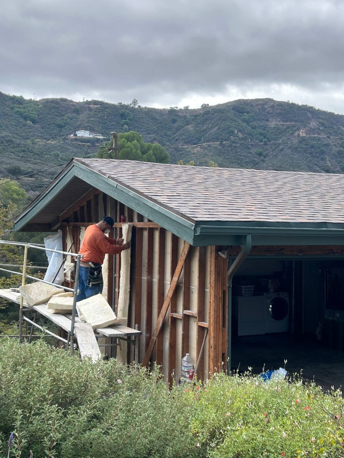 New insulation in the open bays of the garage gable before the wrap went on.